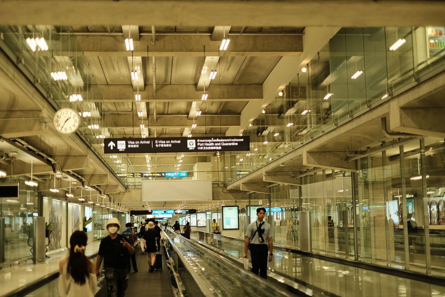 Travellers in a modern arrivals hall